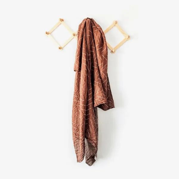 cotton muslin swaddle, rust mud cloth