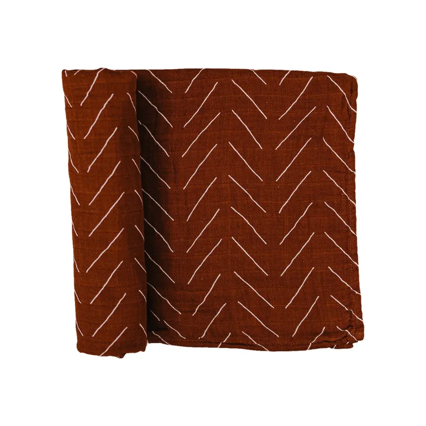 cotton muslin swaddle, rust mud cloth