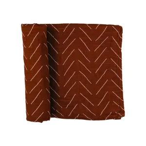 cotton muslin swaddle, rust mud cloth